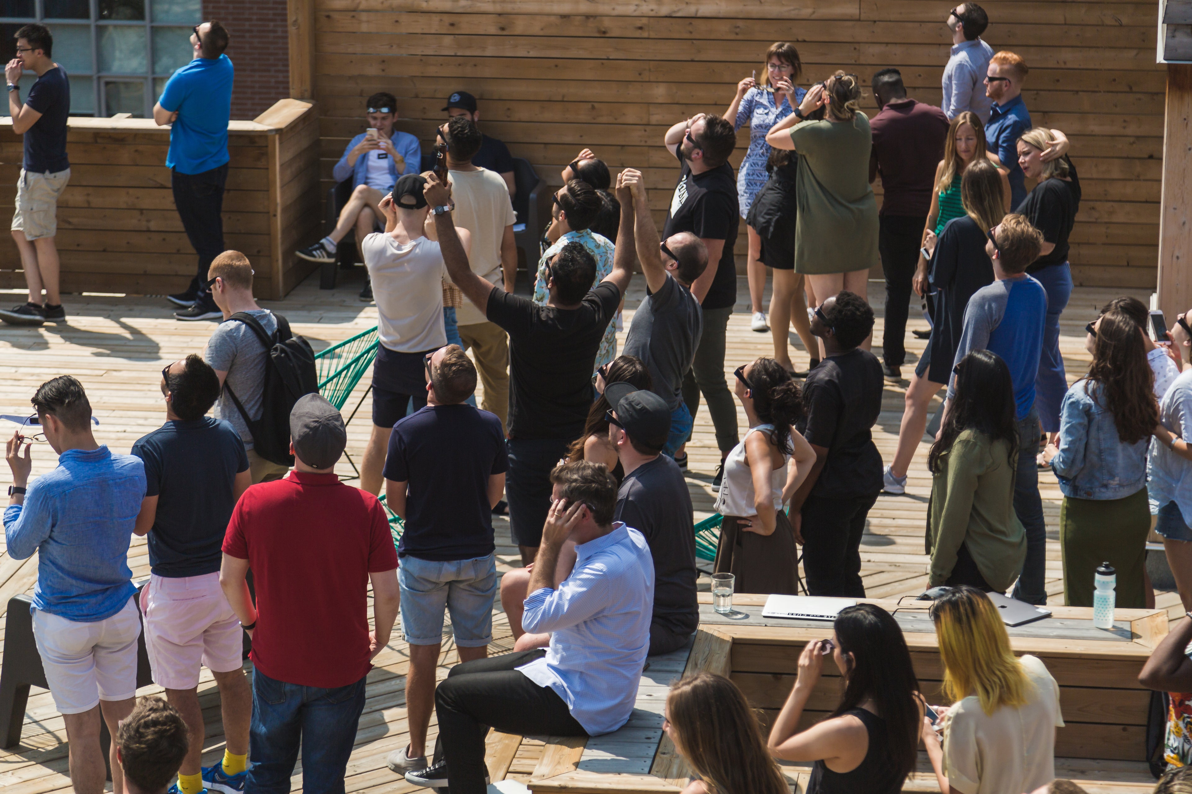 rooftop-crowd-cheers-for-sun - Solar Eclipse International